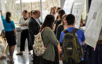 students presenting research posters at EURECA 